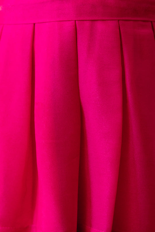 close up fabric shot of a pink dress