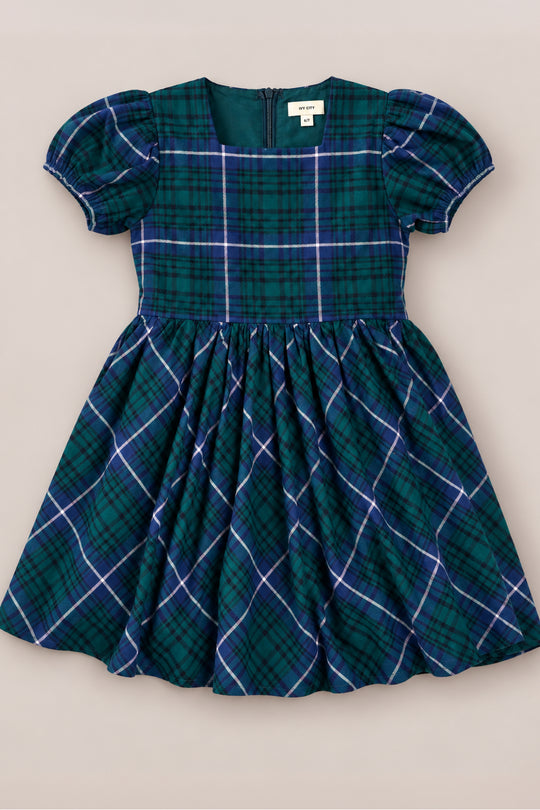 The Mini Cupcake Dress in Emerald Plaid by Ivy City Co features green and blue plaid, puffed short sleeves, a fitted bodice, gathered skirt, and a back zipper—making it the perfect holiday dress for girls to wear at festive gatherings or family photos. Shown on a plain background.