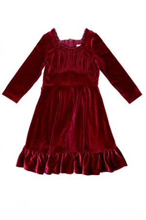 Red velvet dress against a white background