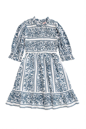 White dress with blue floral patterns on a white background