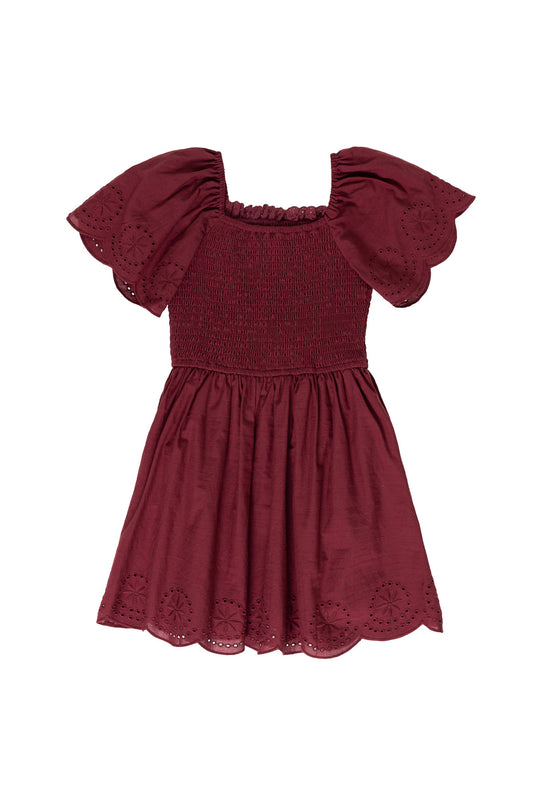 burgundy dress against a white background 