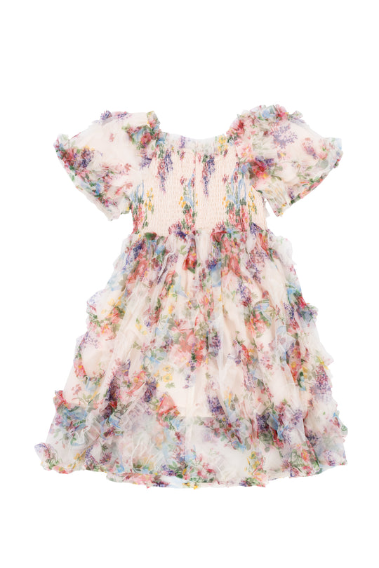 The Ivy City Co Mini Florentina Dress in Pink Floral is a girls short-sleeve, knee-length midi with a smocked bodice, ruffled skirt, and sheer fabric adorned with multicolored flowers for a charming look.