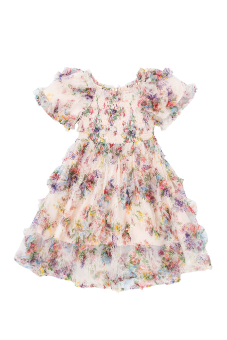 The Ivy City Co Mini Florentina Dress in Pink Floral is a girls’ midi with short sleeves, ruffles, shirred bodice, and layered skirt. Its pastel floral print on lightweight, semi-sheer fabric creates a delicate, airy look.