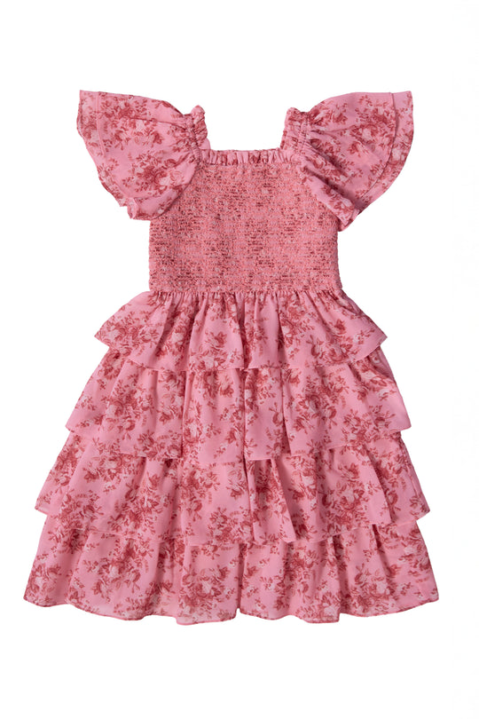 The Mini Grace Dress in Desert Heritage Rose by Ivy City Co is a girls' flutter sleeve maxi dress with a smocked bodice, tiered ruffle skirt, and pink floral print—ideal for special occasions.