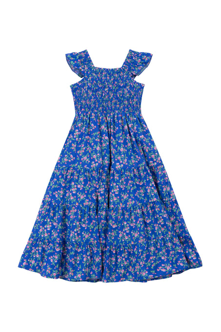 The Mini Hailey Dress in Allie Blue Floral by Ivy City Co is a sleeveless dress featuring ruffled straps, a smocked bodice, and a flared, ankle-length skirt with pink and green floral patterns.