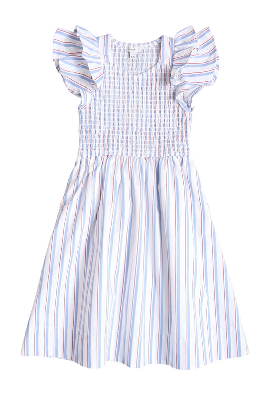The Ivy City Co Mini Hattie Dress in Heritage Stripe is a light blue and white child’s dress with thin red and blue stripes, short ruffled sleeves, smocked bodice, and flared skirt—perfect for the Fourth of July.
