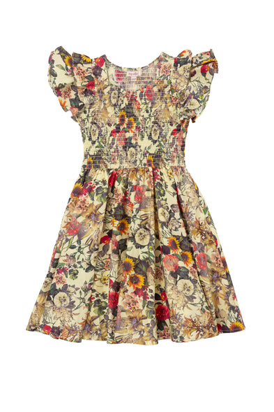 The Mini Hattie Dress in Rose Vine by Ivy City Co is a 100% cotton, knee-length girls’ dress with ruffled short sleeves, a smocked bodice, and a flared skirt featuring a colorful floral print on a light background.