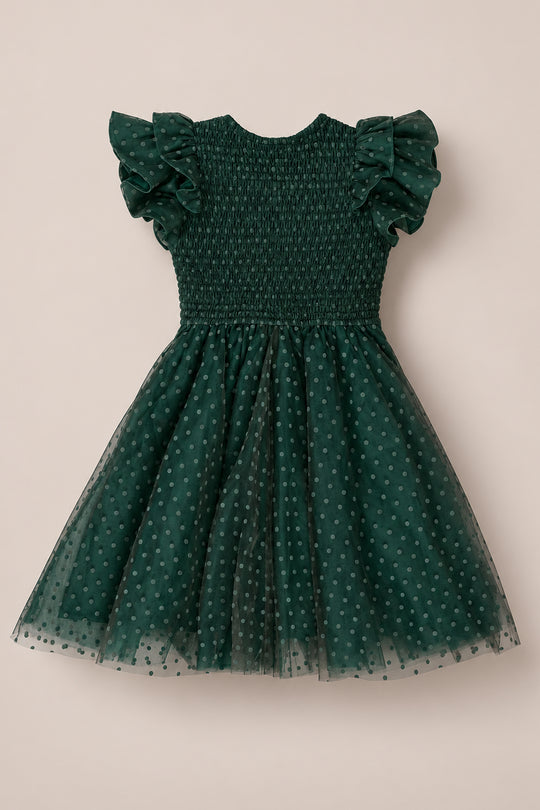 The Ivy City Co Mini Hattie Dress in Green Flocked Dot Tulle for girls features a dark green hue, ruffled sleeves, a smocked bodice, and a tulle skirt adorned with small flocked polka dots, shown against a neutral background.