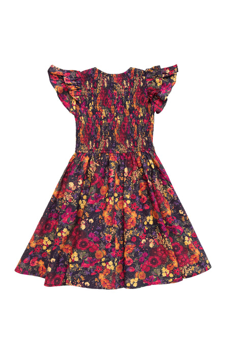 The Mini Hattie Dress in Night Garden by Ivy City Co features a smocked bodice, ruffled short sleeves, and a flared skirt with vibrant floral prints—perfect as a dark floral midi dress for sweet mommy and me moments.