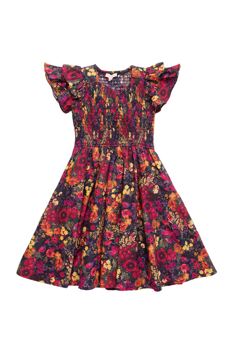 The Ivy City Co Mini Hattie Dress in Night Garden features a vibrant floral pattern, ruffled sleeves, and a smocked bodice. With its flared skirt and decorative design, it’s perfect for matching mommy and me outfits.