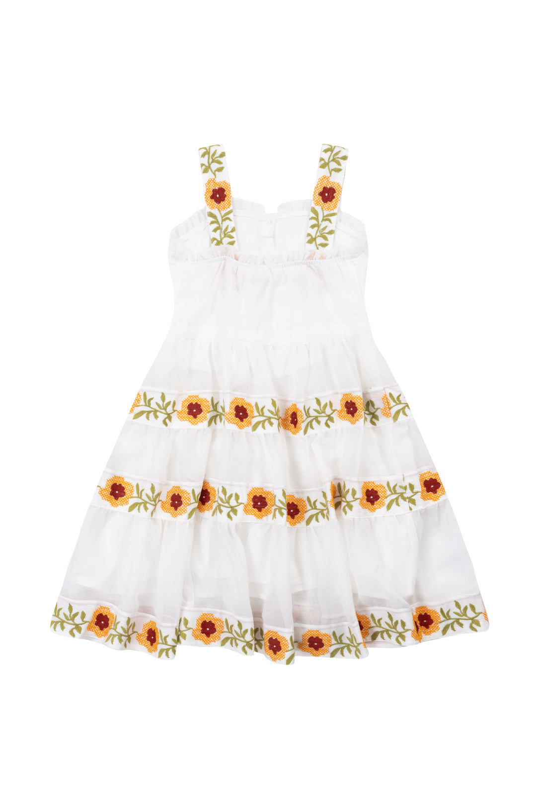 The Mini Katerina Dress by Ivy City Co is a white cotton voile dress with shoulder straps, featuring yellow and red floral embroidery with green leaves on the straps and skirt.