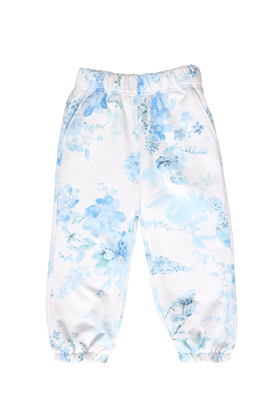 white floral sweat pants against a white background