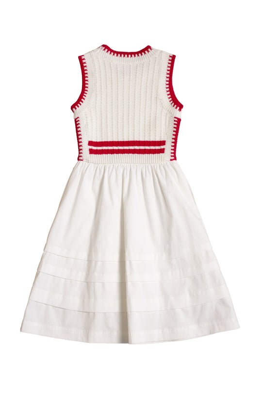 The Ivy City Co Mini Lisbon Dress in Ivory & Firework Red features a sleeveless, ribbed bodice with red trim and a flared, pleated skirt. Shown from the back—an ideal pick for festive Fourth of July celebrations.