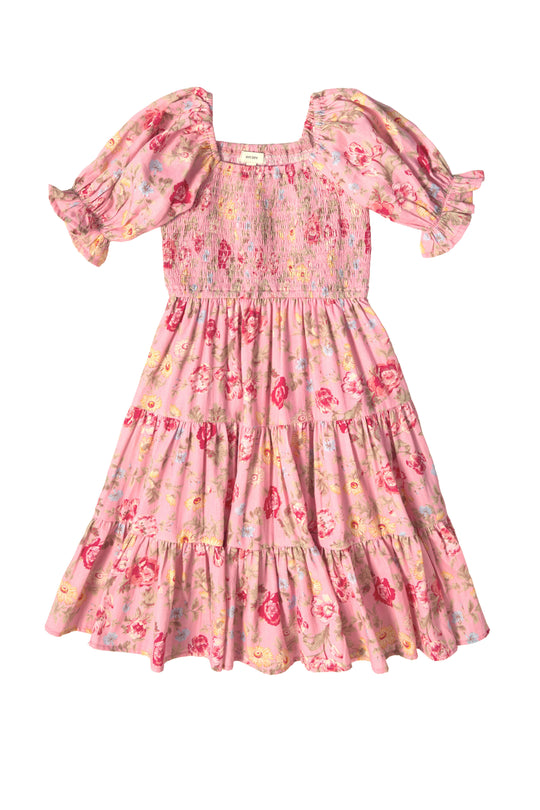 The Mini Madeline Dress in Pink Vintage Poppies by Ivy City Co features puffed short sleeves, a smocked bodice, tiered ruffled skirt, square neckline, and an all-over colorful floral print—perfect for spring.