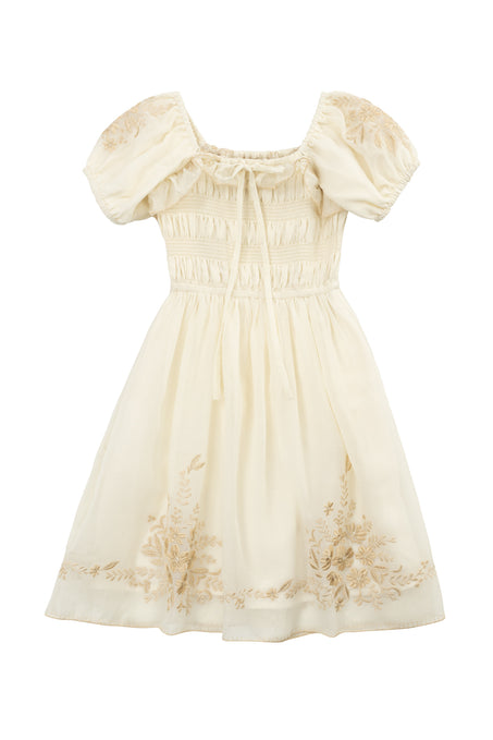 The Mini Mae Dress in Metallic Thread by Ivy City Co features hand embroidery, puffed short sleeves, a gathered bodice with tie, and floral accents—a vintage-inspired cream dress perfect for matching mom and daughter looks.