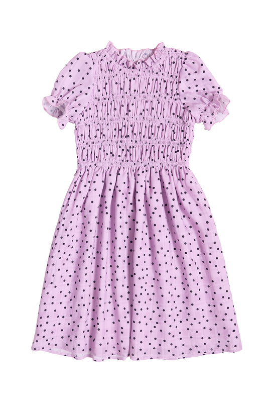 The front of a Girls purple dress with black polka dots against a white background