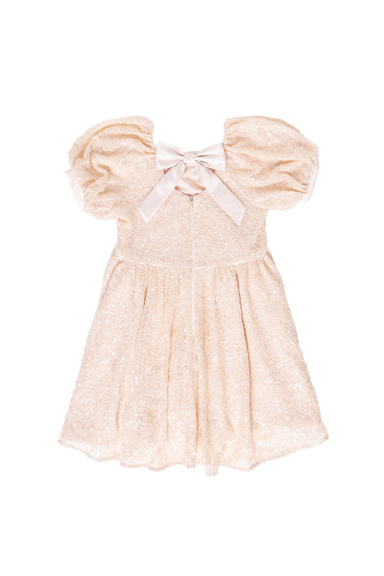 cream sequin dress against a white background