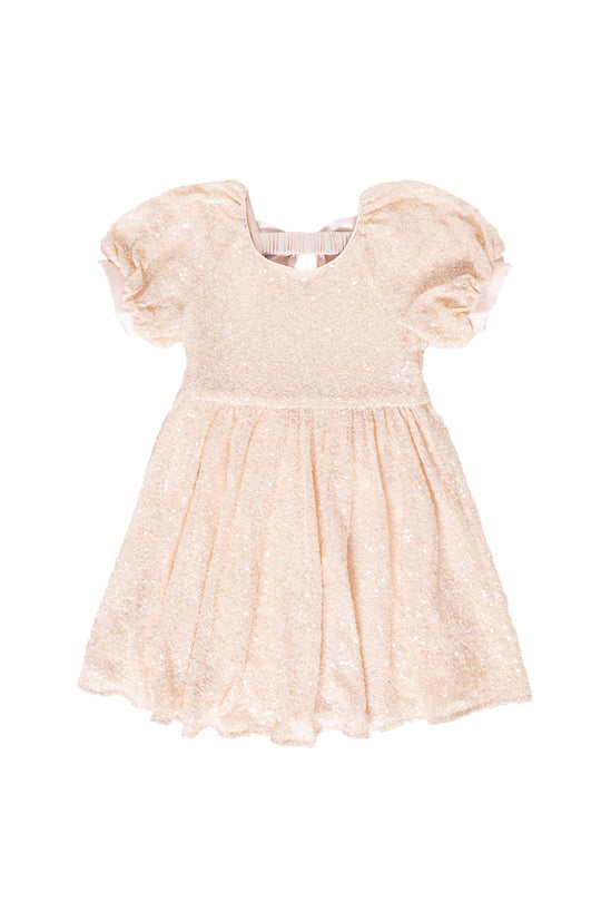 cream sequin dress against a white background