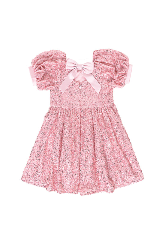 the back of a Pink sequin dress against a white background