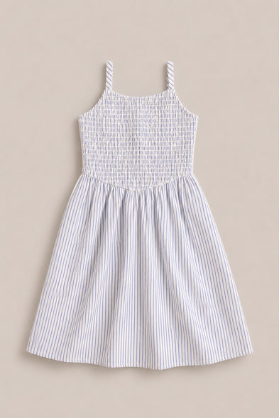 The Mini Maxwell Dress in Blue & White Pinstripe by Ivy City Co features a sleeveless design, smocked bodice, flared skirt, and thin blue stripes—ideal for stylish Mom and Me matching outfits.