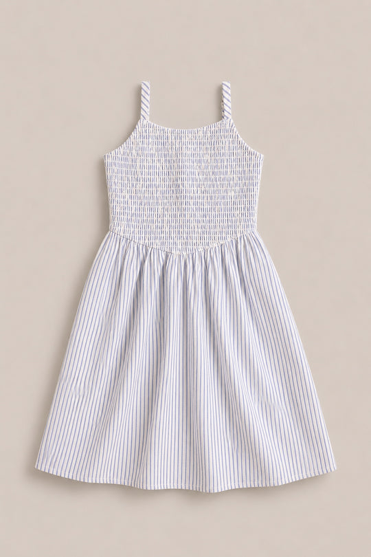 The Mini Maxwell Dress in Blue & White Pinstripe by Ivy City Co features a sleeveless design, smocked bodice, flared skirt, and thin blue stripes—ideal for stylish Mom and Me matching outfits.