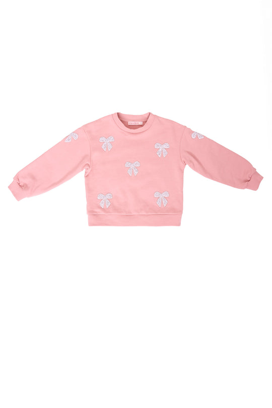 Pink sweatshirt with rhinestone bows against a white background