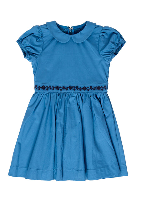 Blue dress with ruffled sleeves and collar on a white background