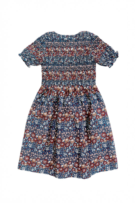 Floral dress with a pattern of small flowers on a white background