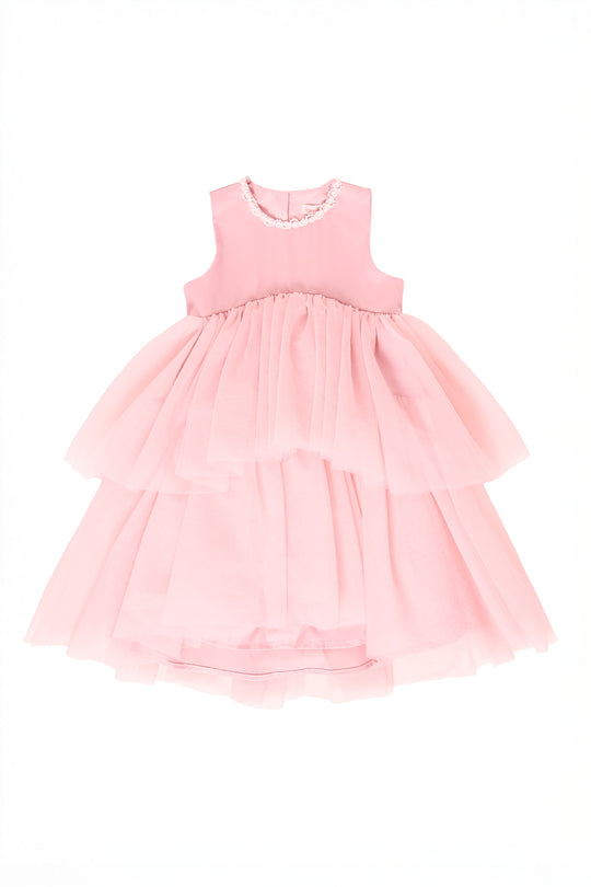 Pink tiered dress on a white background