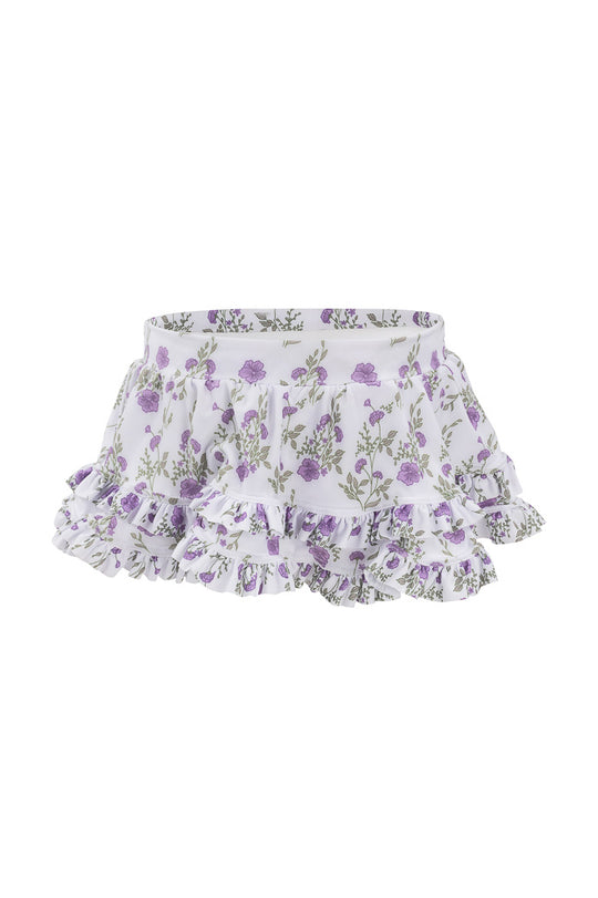 The Mini Rita Ruffle Skirt in Maeve Floral by Ivy City Co features white tiered ruffles, a purple floral pattern, and an elastic waistband, shown against a plain white background.