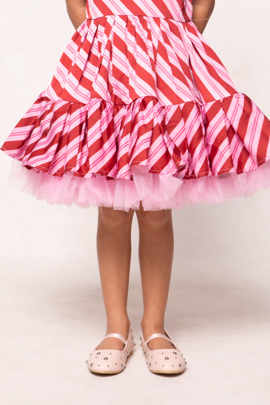 Red and pink striped dress with a tutu skirt on a white background
