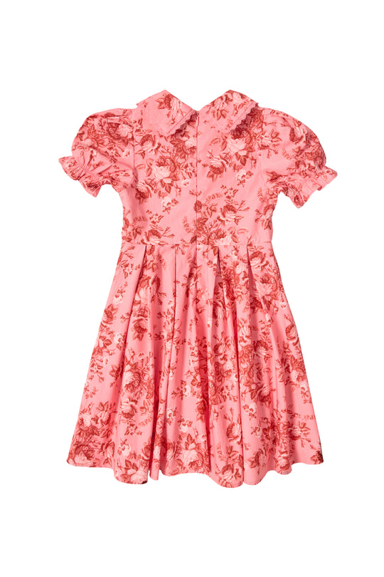 The Mini Sophia Dress in Desert Heritage Rose by Ivy City Co features a pink floral cotton design with a collar, puffed short sleeves, and flared skirt—perfect for girls as an Easter dress. Shown on a white background.