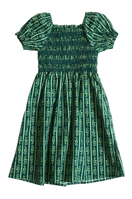 The Ivy City Co Mini Sunday Best Dress in Pine Felicity Floral is a green girls’ cotton dress with puffed sleeves, smocked bodice, and knee-length gathered skirt—perfect for a charming everyday look.