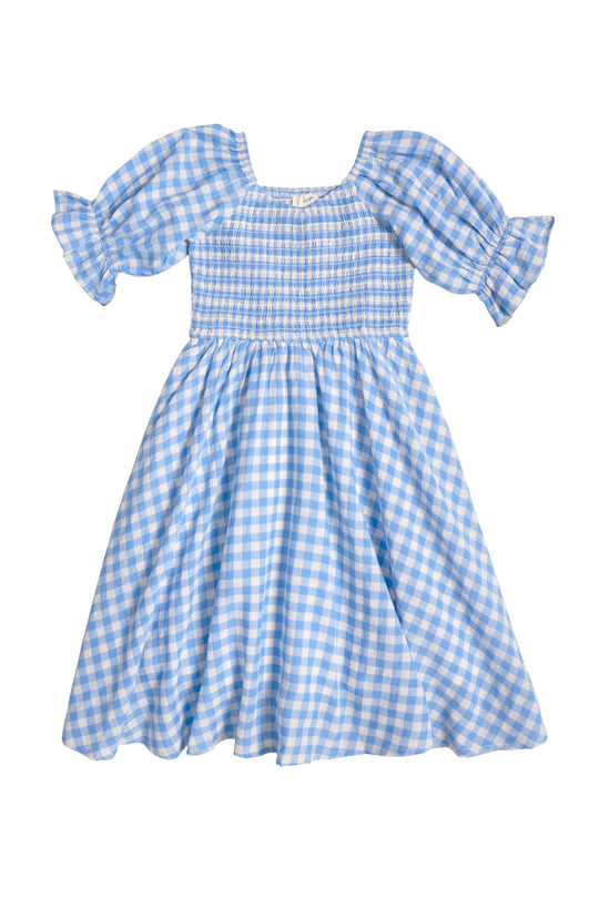 The Ivy City Co Mini Teagan Dress in Blue Gingham features puffed short sleeves, a smocked bodice, and a flared skirt—perfect as a girls’ spring dress—shown on a white background.