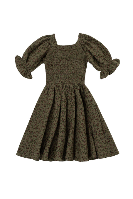 The Mini Teagan Dress in Woodland Floral by Ivy City Co features a green floral print, puffed short sleeves, smocked bodice, flared skirt, and a square neckline for a charming, stylish look.