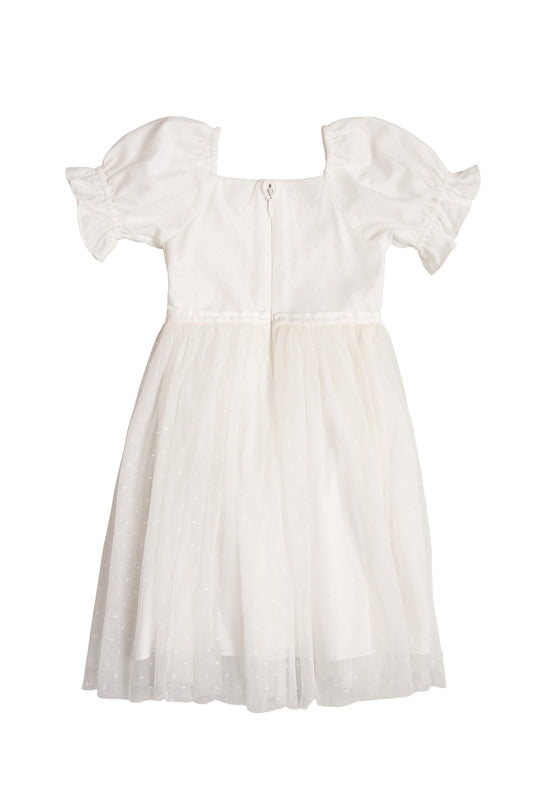 The Mini Ballerina Dress in White by Ivy City Co features short puff sleeves, a fitted bodice, back zipper, and a sheer layered tulle skirt with a subtle dotted pattern.