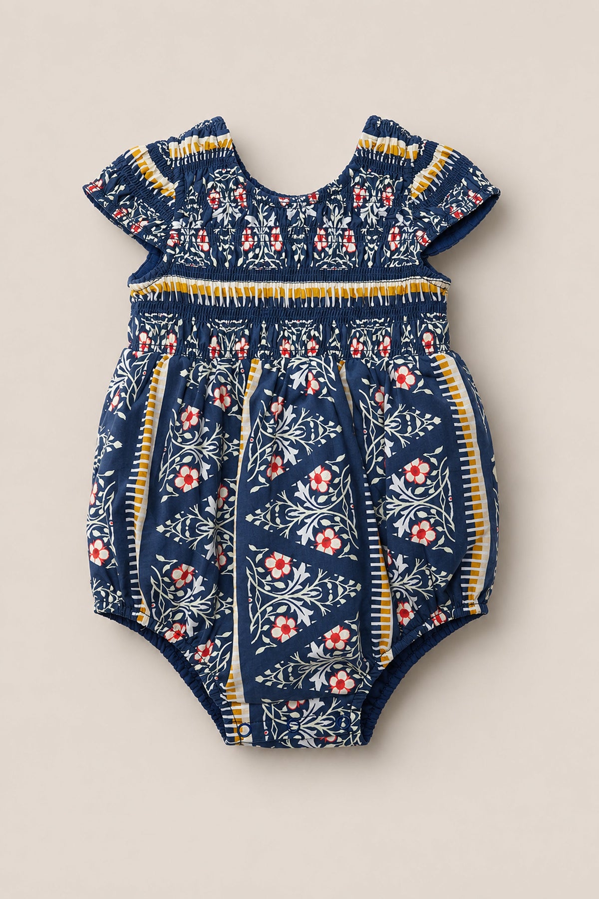 Sure! Here’s a rewritten sentence using your product data: The Baby Marlow Romper in Navy Fleur by Ivy City Co is a short-sleeve baby romper featuring a navy blue base with white and red floral patterns and yellow striped accents.