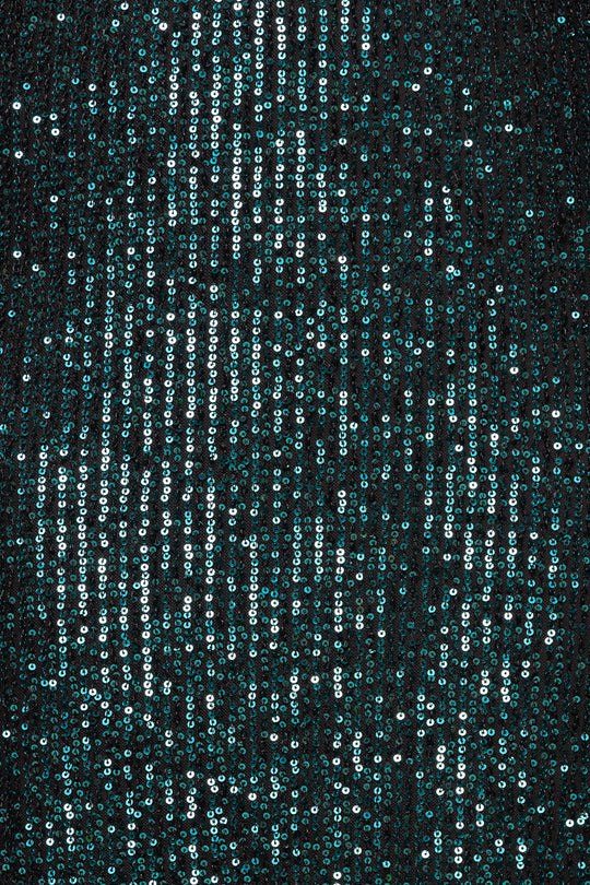 Sequined fabric with a black background