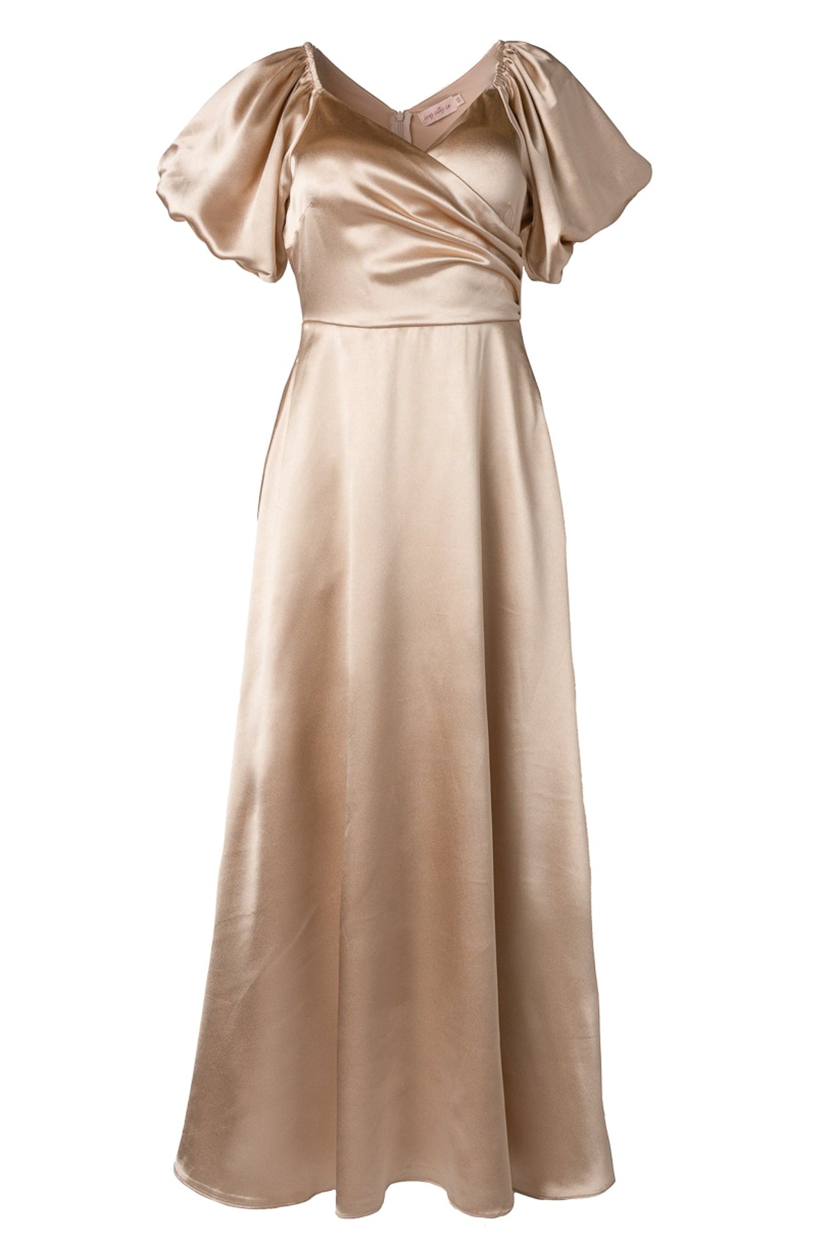 The Tessie Dress in Champagne by Ivy City Co is an elegant, floor-length satin bridesmaid dress featuring short puff sleeves, a v-neckline, and a fitted bodice with a subtle wrap design.