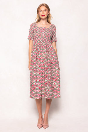 Woman wearing a floral dress on a white background