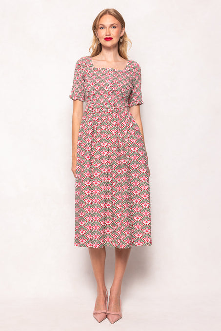 Woman wearing a floral dress on a white background