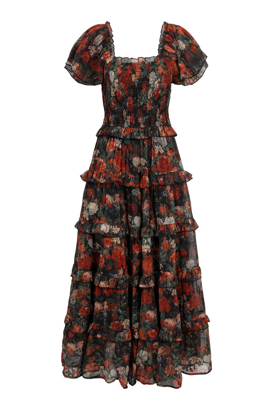 Introducing the Winnie Dress in Midnight Roses by Ivy City Co—a long, tiered dress crafted from sheer black fabric adorned with a dark floral print in rich red and green tones. Featuring short puff sleeves and a smocked bodice, this elegant style is also maternity friendly.