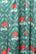 Textile with red floral pattern on a green background