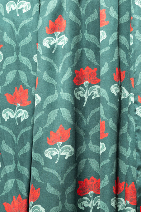 Textile with red floral pattern on a green background