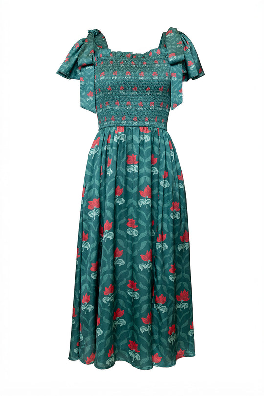 Green dress with red floral pattern on a white background