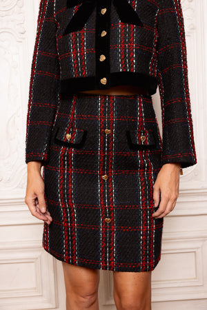 Black and red plaid coat with matching skirt on a white background
