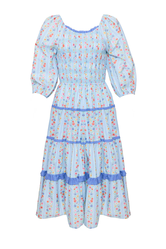 blue floral dress against a white background