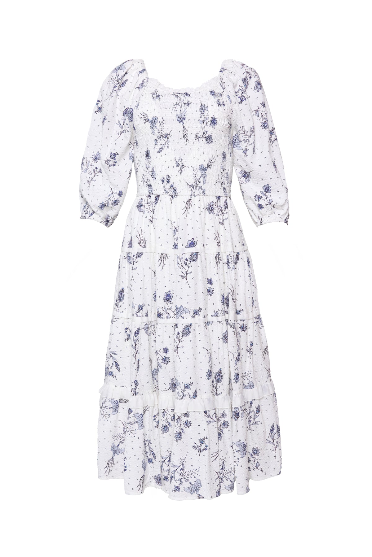 The Roselyn Dress in Blue Enchanted Floral by Ivy City Co is a white, knee-length dress with blue florals, puffed three-quarter sleeves, a tiered skirt, and a maternity-friendly design.