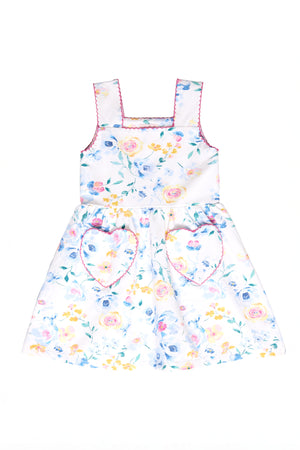 White floral dress against a white backdrop