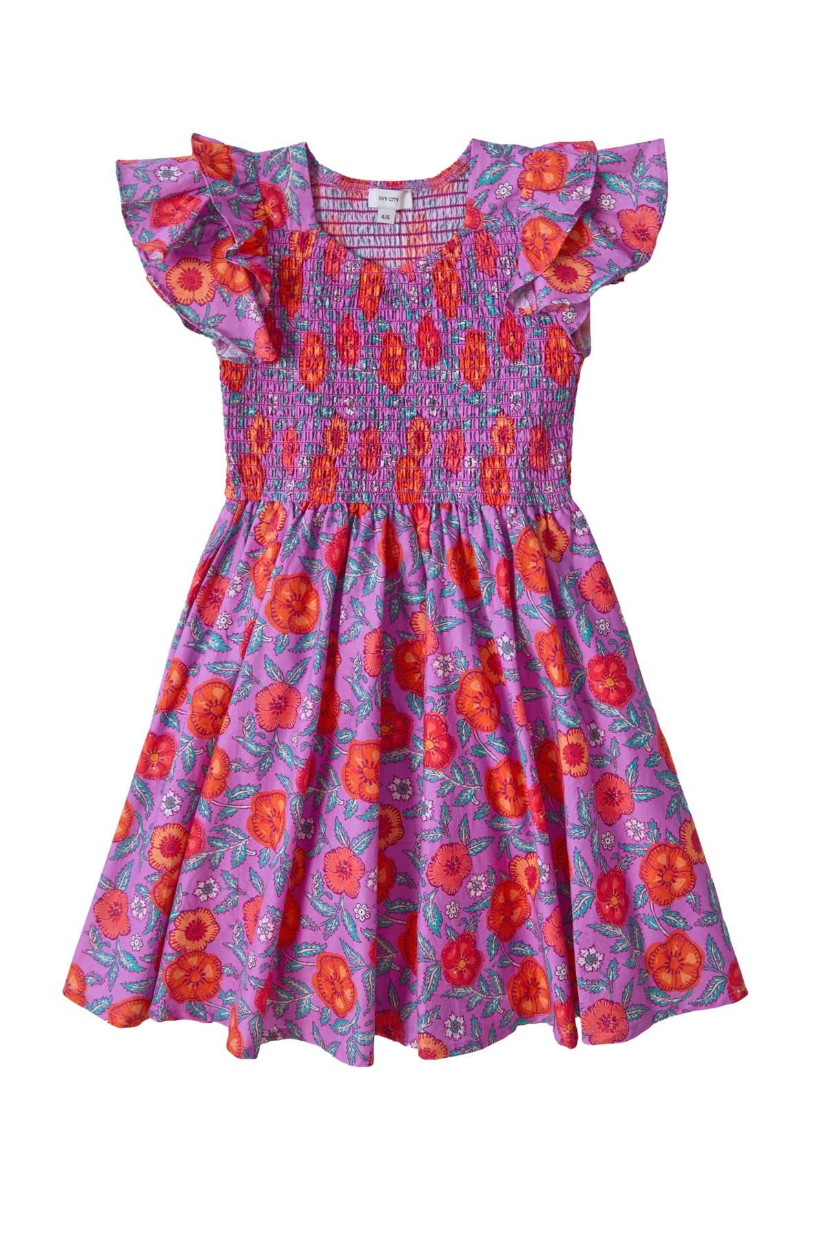The Mini Hattie Dress in Thistle Flower Poppy Woodblock by Ivy City Co is a short-sleeve, purple cotton midi dress featuring ruffled sleeves, a red floral pattern, a smocked bodice, and a flared skirt—perfect for matching mom and daughter outfits.